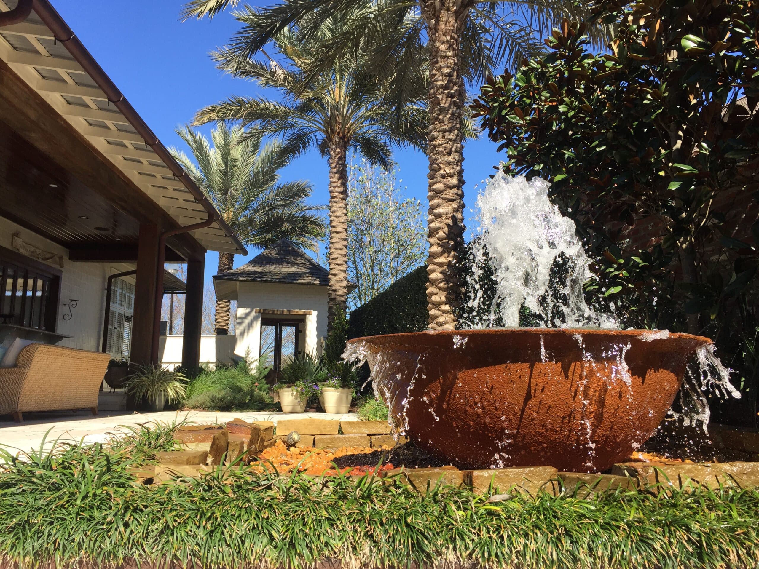 fountain next to palm trees
